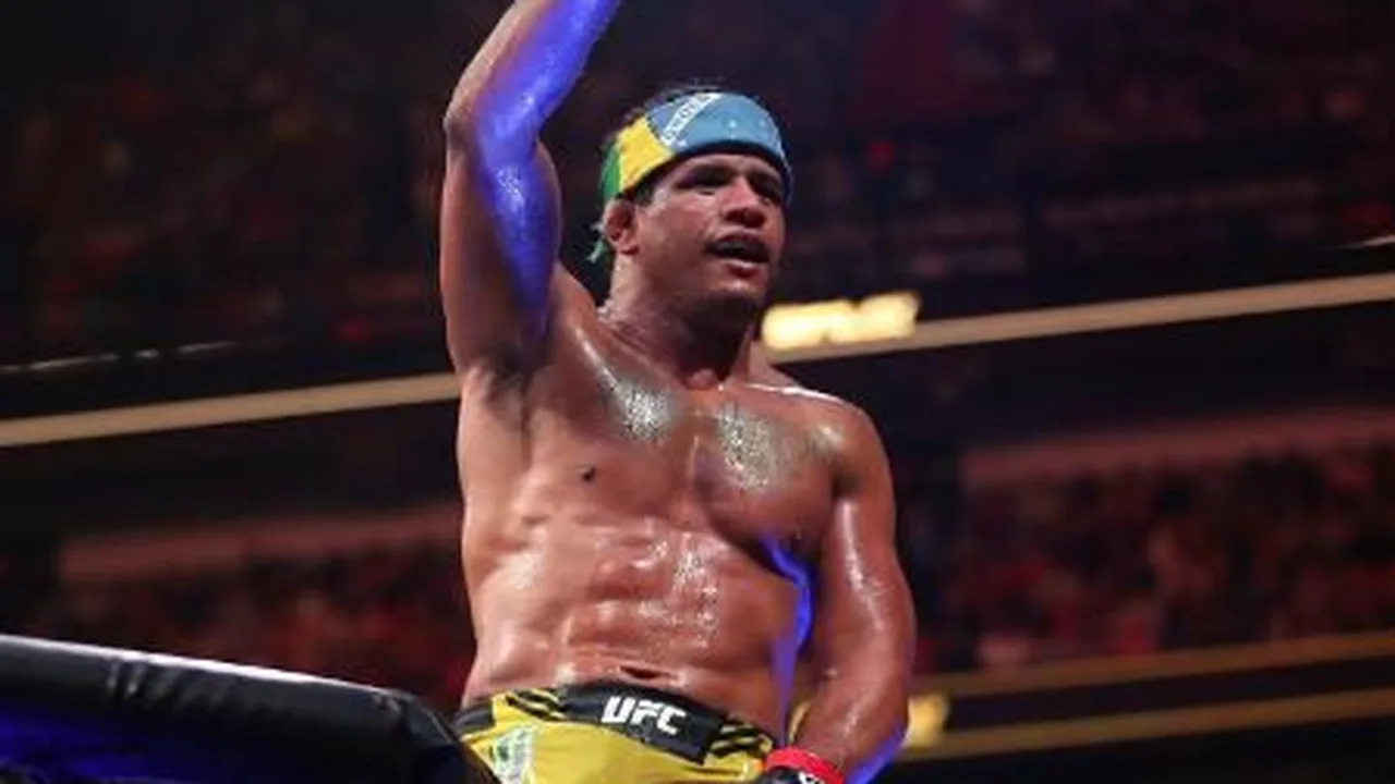 Gilbert Burns colocando luvas no centro do octógono simbolizando aposentadoria do MMA