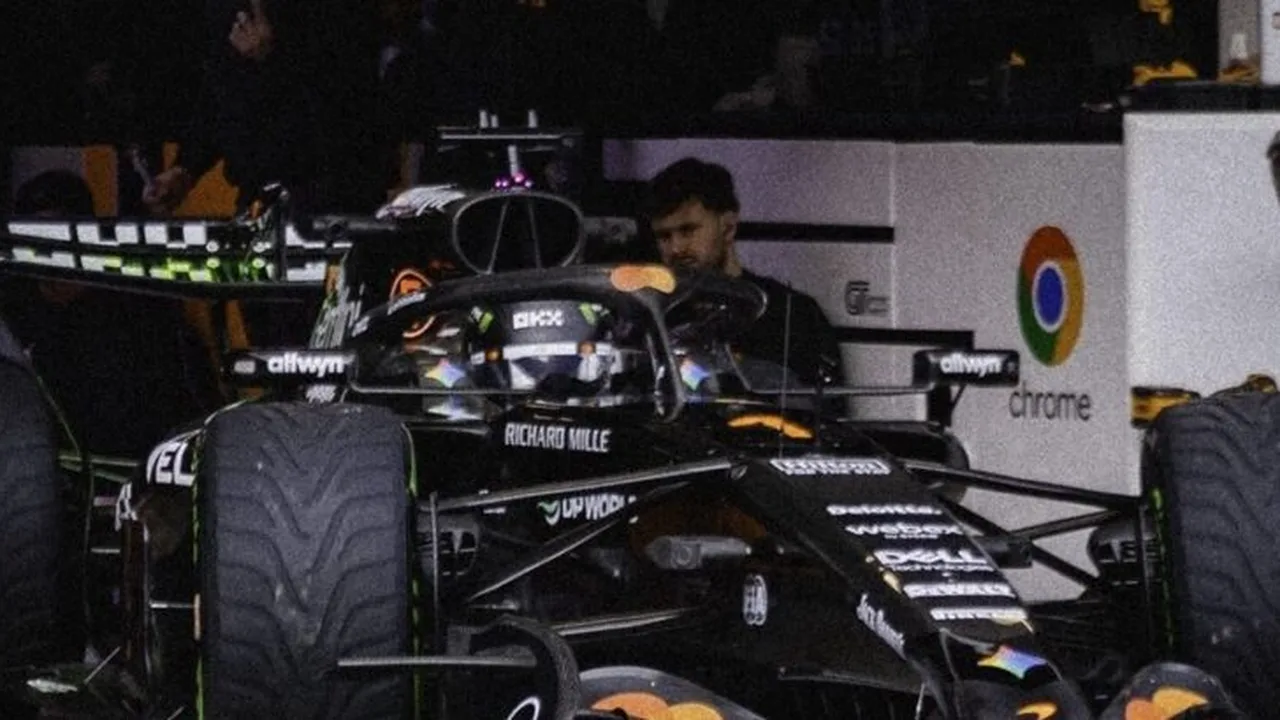 Lando Norris pilotando McLaren laranja em circuito de Fórmula 1 com foco nos pneus e aerodinâmica do carro