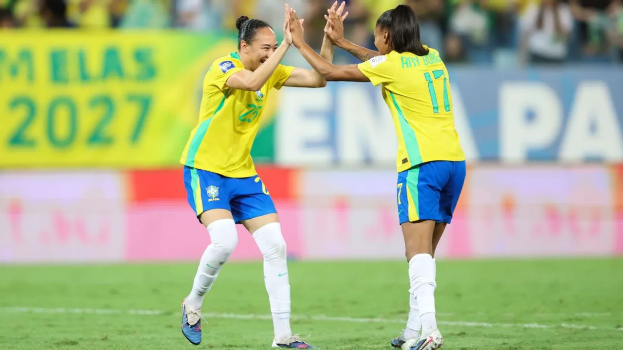 Jogadoras comemorando classificação para a Copa do Mundo Feminina de 2027 com bandeiras da Alemanha e Argentina