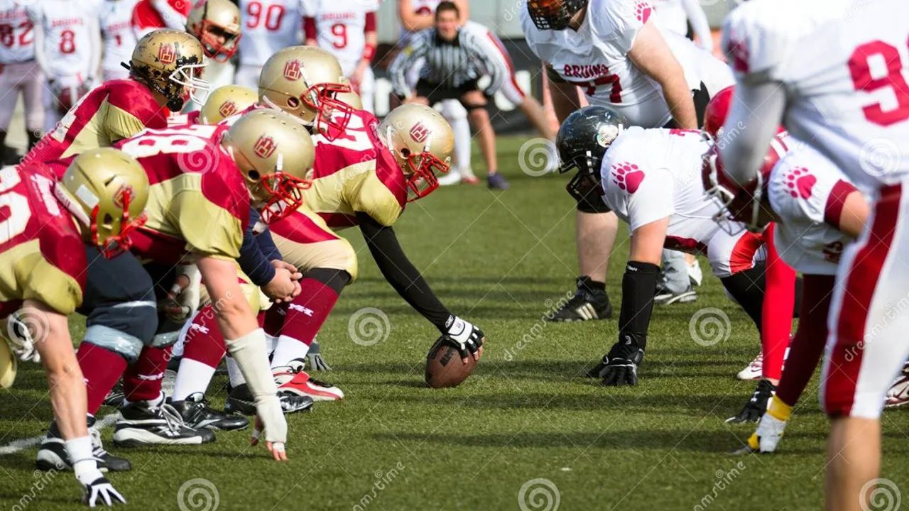 Jogador de futebol americano segurando capacete em campo com plateia ao fundo, representando salários da NFL